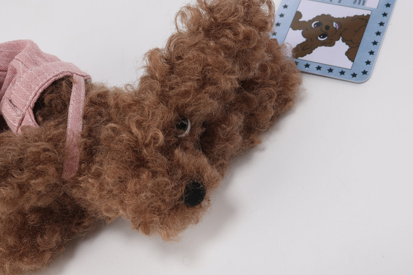 Pink striped overalls with brown scribbles puppy