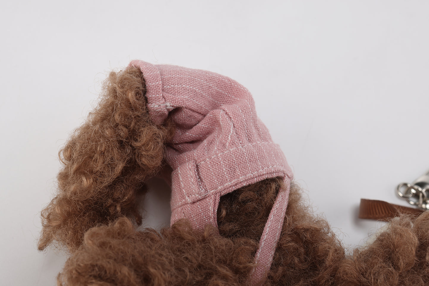 Pink striped overalls with brown scribbles puppy
