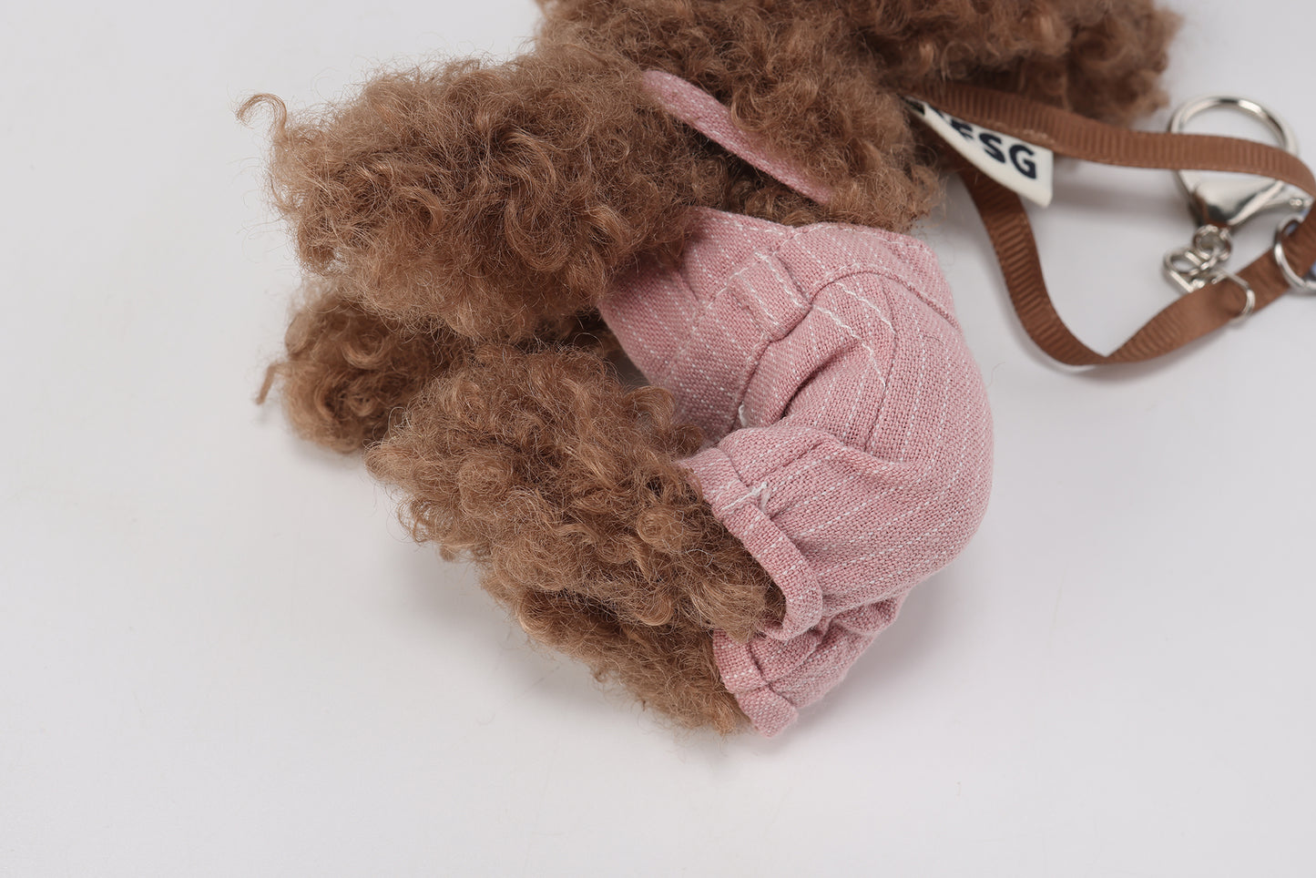 Pink striped overalls with brown scribbles puppy