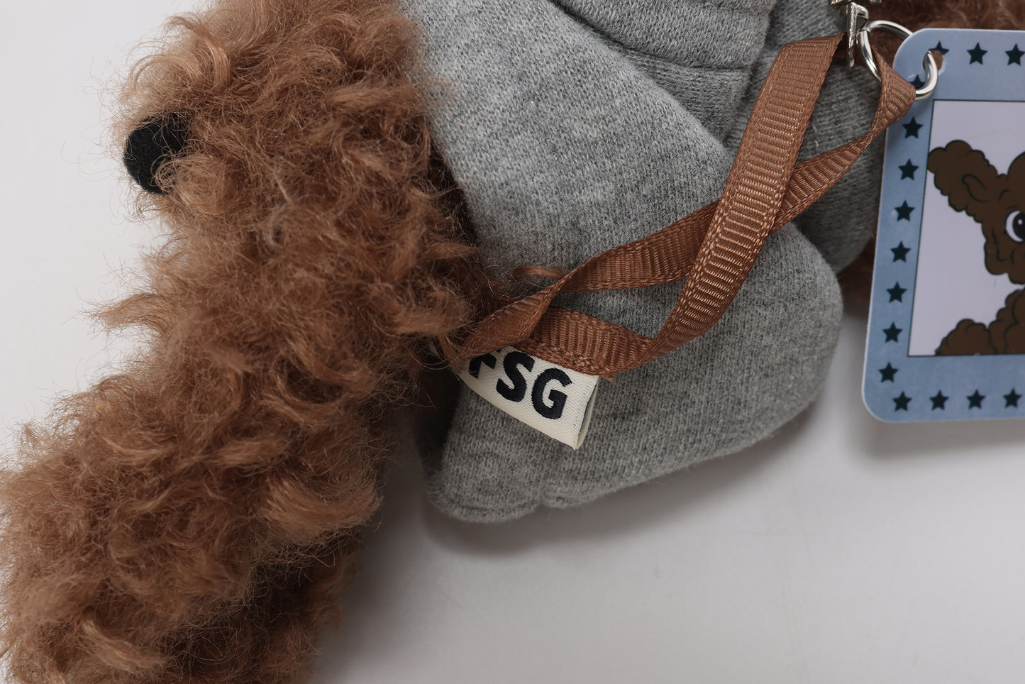 Sweat à capuche gris SFSG avec un chiot griffonné marron